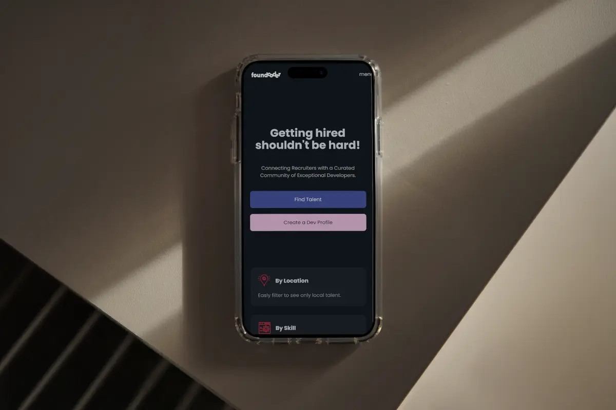 A phone showing the found coder website