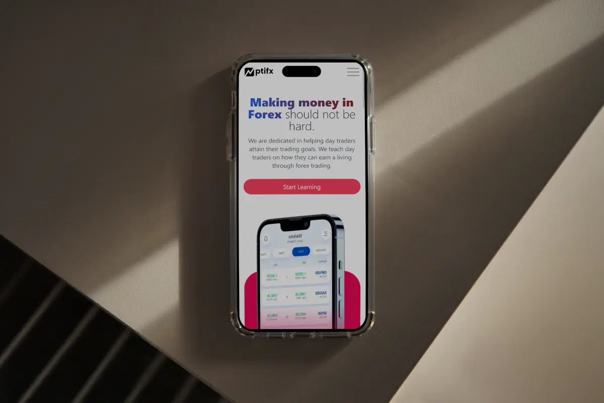 A phone showing ptiforex website